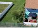 Aerial view showcasing property, private patio, and fenced yard at 59 Chippingwood Ln, Ormond Beach, FL 32176