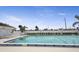 Community pool with lounge chairs and surrounding landscaping at 59 Chippingwood Ln, Ormond Beach, FL 32176