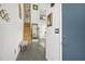 Bright entryway with tiled floors, wooden staircase, and a bench at 59 Chippingwood Ln, Ormond Beach, FL 32176