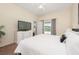 Main bedroom with king bed, private access to the pool, and dresser at 526 Windsor Pl, Davenport, FL 33896