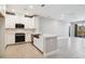 Modern kitchen with stainless steel appliances and white cabinetry at 7557 Laureate Blvd # 6208, Orlando, FL 32827