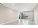 Spacious living room with tile floors and access to a balcony at 7557 Laureate Blvd # 6208, Orlando, FL 32827