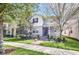 Two-story home with gray siding, red shutters, and a landscaped front yard at 8233 Lakeview Crossing Dr, Winter Garden, FL 34787