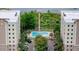 Aerial view of condo community with pool and lake at 6312 Buford St # 303, Orlando, FL 32835