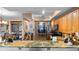 Modern kitchen with granite countertops and wood cabinets at 6312 Buford St # 303, Orlando, FL 32835