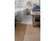 Bright laundry room with two washers, dryer, and tile floor at 6312 Buford St # 303, Orlando, FL 32835