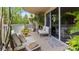 Private balcony with comfortable seating and lush greenery at 6312 Buford St # 303, Orlando, FL 32835