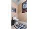 Clean bathroom with a toilet and decorative rug at 6312 Buford St # 303, Orlando, FL 32835