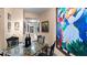 Elegant dining area with granite-top table and modern chairs at 6312 Buford St # 303, Orlando, FL 32835