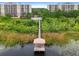 Aerial view of condo community with lake access and dock at 6312 Buford St # 303, Orlando, FL 32835