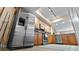 Modern kitchen with stainless steel appliances and wood cabinets at 6312 Buford St # 303, Orlando, FL 32835