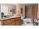 Clean bathroom with granite countertop and tub at 6312 Buford St # 303, Orlando, FL 32835