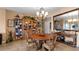 Charming dining room with a round wooden table and four chairs at 6312 Buford St # 303, Orlando, FL 32835