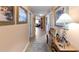 Hallway with decorative table and artwork at 6312 Buford St # 303, Orlando, FL 32835