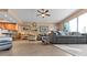 Open living space with gray couch and kitchen views at 6312 Buford St # 303, Orlando, FL 32835