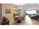 Bright dining area with views into living room and kitchen at 6312 Buford St # 303, Orlando, FL 32835