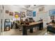 Home office with large desk and wall decor at 6312 Buford St # 303, Orlando, FL 32835