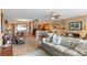 Open living room with comfortable seating and a view of dining area at 6312 Buford St # 303, Orlando, FL 32835