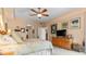 Bright bedroom with king-size bed, ceiling fan, and ample natural light at 6312 Buford St # 303, Orlando, FL 32835