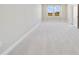 Spacious bedroom with neutral carpeting and large windows at 7521 Laureate Blvd # 5304, Orlando, FL 32827