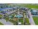 Aerial view of apartment community with pool, tennis court, and playground at 7521 Laureate Blvd # 5304, Orlando, FL 32827