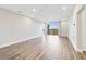 Spacious living room with wood-look floors and access to balcony at 7521 Laureate Blvd # 5304, Orlando, FL 32827