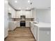 Modern kitchen with white cabinets and quartz countertops at 7521 Laureate Blvd # 5304, Orlando, FL 32827