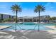 Community pool with spacious deck and plenty of lounge chairs at 7521 Laureate Blvd # 5304, Orlando, FL 32827
