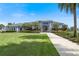 Modern community building with landscaping and walkway at 7521 Laureate Blvd # 5304, Orlando, FL 32827