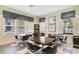 Bright community room with tables and chairs at 7557 Laureate Blvd # 6208, Orlando, FL 32827