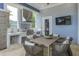 Outdoor kitchen with stainless steel appliances and dining area at 7557 Laureate Blvd # 6208, Orlando, FL 32827