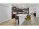 Modern kitchen with dark cabinetry, quartz countertops, and an island at 875 Fillmore Ct, Davenport, FL 33837