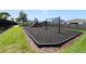 Community playground with swings and climbing structures at 875 Fillmore Ct, Davenport, FL 33837