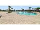 Community pool with brick pavers and lounge chairs at 875 Fillmore Ct, Davenport, FL 33837