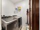 Laundry room with washer, dryer, and ample storage at 875 Fillmore Ct, Davenport, FL 33837