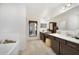 Double vanity bathroom with a soaking tub and separate shower at 875 Fillmore Ct, Davenport, FL 33837