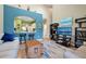 Open kitchen with breakfast bar and view into the living room at 3587 Casalta Cir, New Smyrna Beach, FL 32168