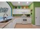 Updated kitchen with white cabinets, granite counters, and stainless steel appliances at 3587 Casalta Cir, New Smyrna Beach, FL 32168