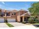 Two-story townhome with two-car garage and front porch at 3587 Casalta Cir, New Smyrna Beach, FL 32168
