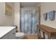 Clean bathroom with white vanity, shower, and beach-themed decor at 3587 Casalta Cir, New Smyrna Beach, FL 32168