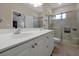 Bathroom with double vanity and walk-in shower at 3587 Casalta Cir, New Smyrna Beach, FL 32168