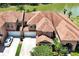 Stunning aerial view of two-story home, two car garage and landscaped yard at 3587 Casalta Cir, New Smyrna Beach, FL 32168
