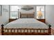 Bedroom with bamboo bed frame and wood nightstands at 3587 Casalta Cir, New Smyrna Beach, FL 32168