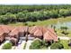 Aerial view of property showcasing a large home with lake access at 3587 Casalta Cir, New Smyrna Beach, FL 32168