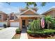 Two-story townhome with front porch and American flag at 3587 Casalta Cir, New Smyrna Beach, FL 32168