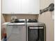 Bright laundry room, featuring LG washer and dryer, and ample storage at 3587 Casalta Cir, New Smyrna Beach, FL 32168