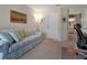Spacious home office with a sofa, desk, and adjacent bathroom at 3587 Casalta Cir, New Smyrna Beach, FL 32168