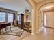 Inviting entryway with arched hallways and hardwood floors at 251 Silver Maple Rd, Groveland, FL 34736