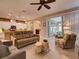 Spacious living area with comfortable seating and access to a lanai at 251 Silver Maple Rd, Groveland, FL 34736