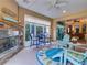 Relaxing sunroom featuring a fireplace, stylish seating area, and view of backyard at 251 Silver Maple Rd, Groveland, FL 34736